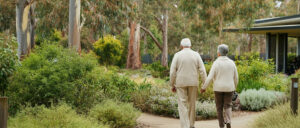 Couple enjoying a peaceful walk in a retirement community garden.