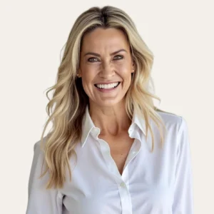 Smiling woman in white shirt representing retirement community and aged care services.