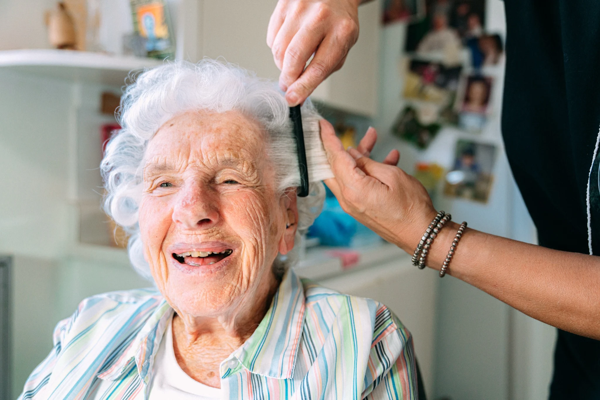 Sundale carer sharing a friendly moment with a senior during a Queensland in-home aged care visit
