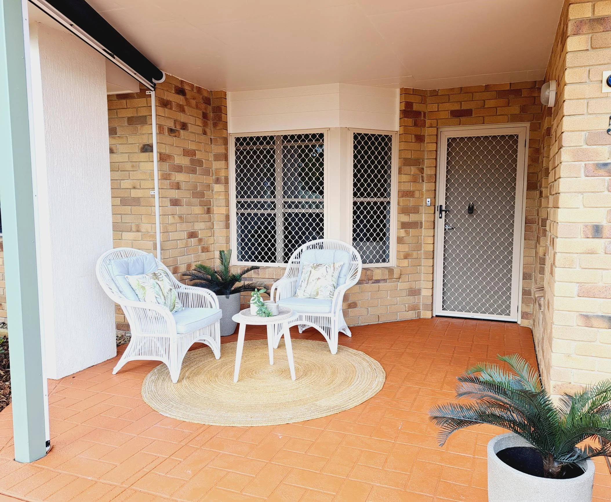 Stylish outdoor seating area in Sundale retirement community unit 63.