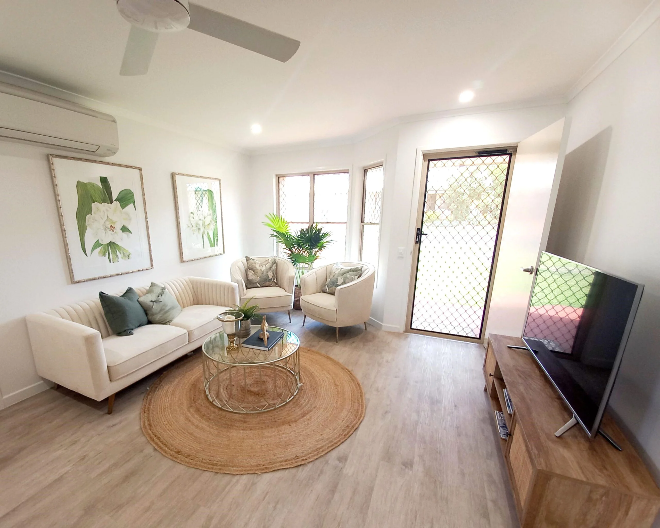 Bright and welcoming living area in Sundale retirement community unit.