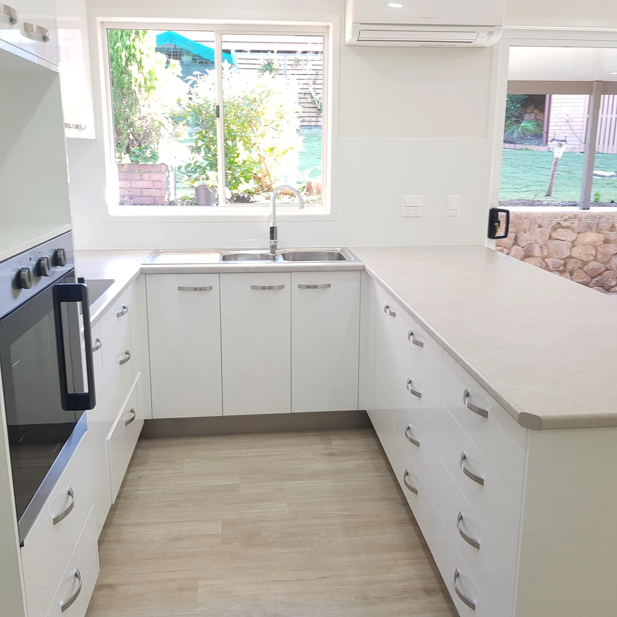 Spacious, modern kitchen in retirement community unit with low maintenance features.